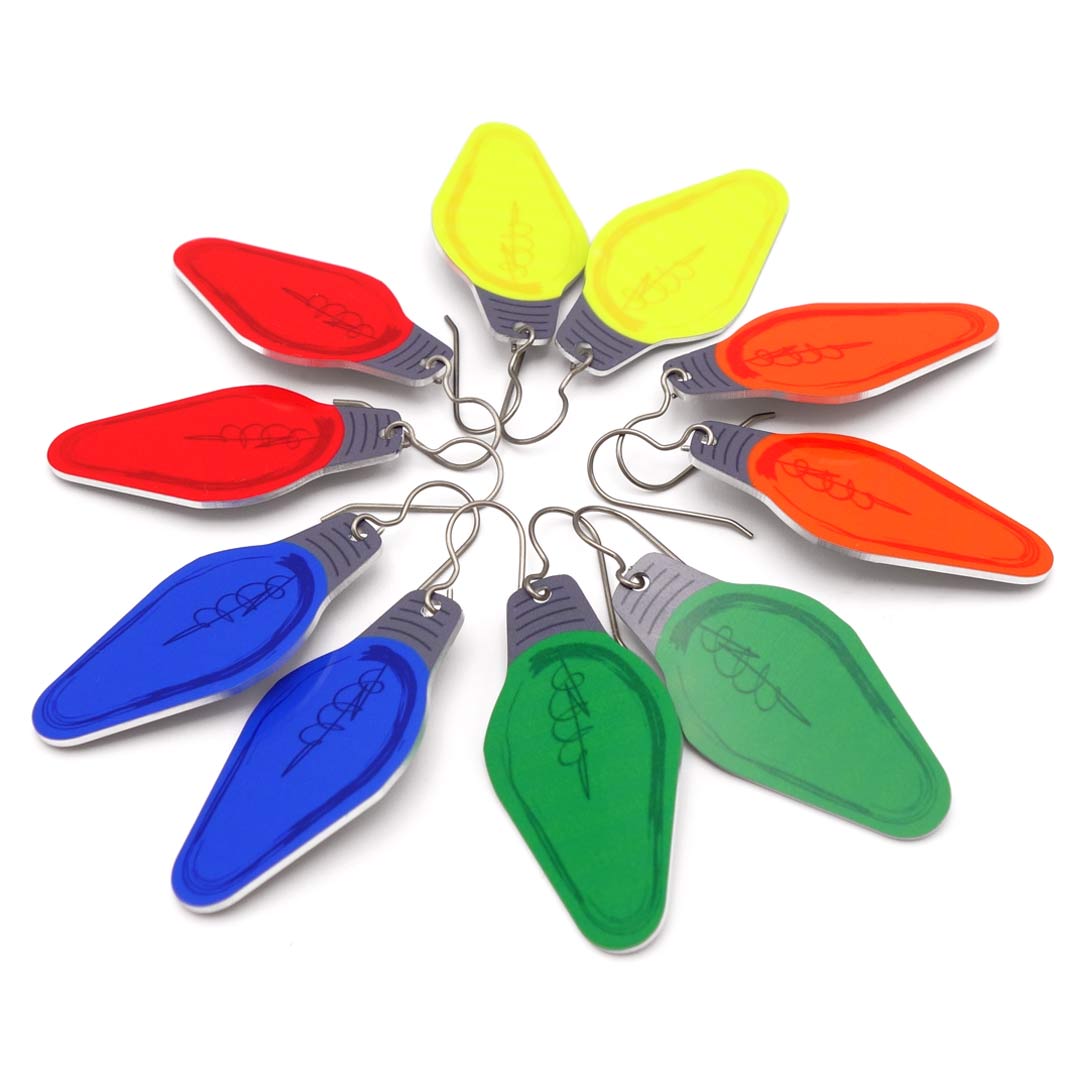 Five pairs of colorful Christmas light bulb earrings by ColorUpLife.
