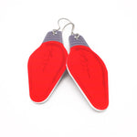 A pair of red Christmas light bulb earrings by ColorUpLife.