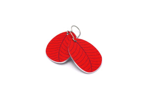 A pair of small leaf earrings in red by ColorUpLife.