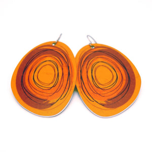 Large solid oval-shaped hoop earrings with brown graphics by ColorUpLife.