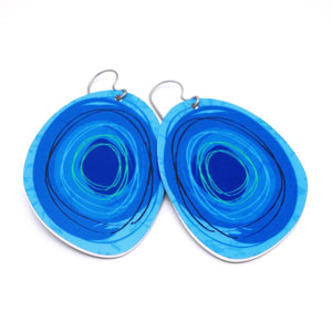 Large solid oval-shaped hoop earrings with dark blue graphics by ColorUpLife.