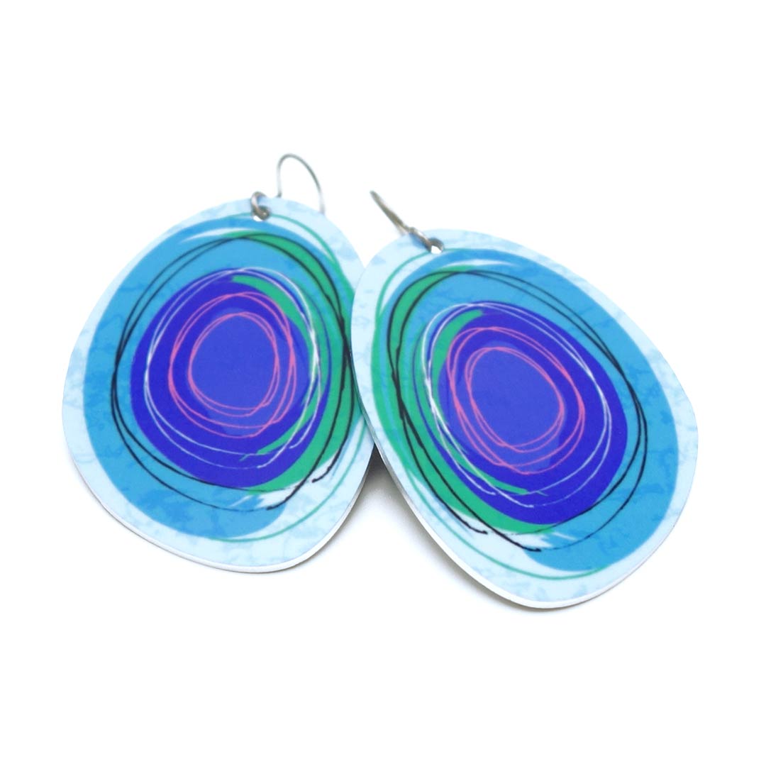 Large solid oval-shaped hoop earrings with bright pink and blue graphics by ColorUpLife.