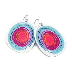 Large solid oval-shaped hoop earrings with bright pink and blue graphics by ColorUpLife.