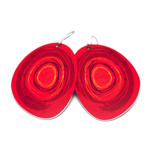 Large solid oval-shaped hoop earrings with red graphics by ColorUpLife.