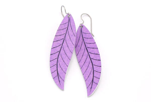 A pair of long lavender leaf earrings by ColorUpLife.
