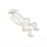 A pair of minimalist, wavy, light gray dangle earrings made of aluminum metal with silver-toned titanium fishhook ear wires, displayed on a clean white background.