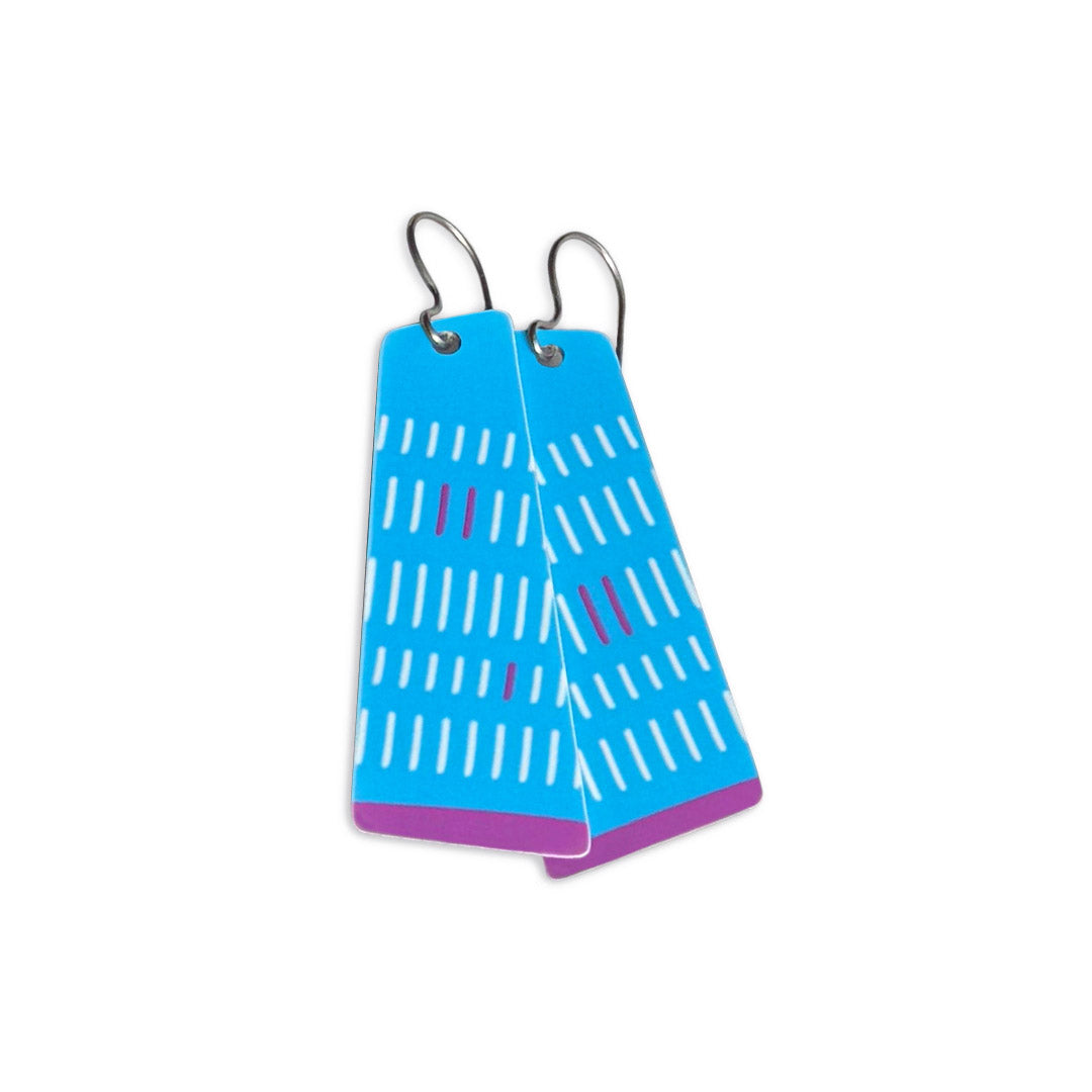 Blue and purple dangle earrings with a geometric pattern on a white background.