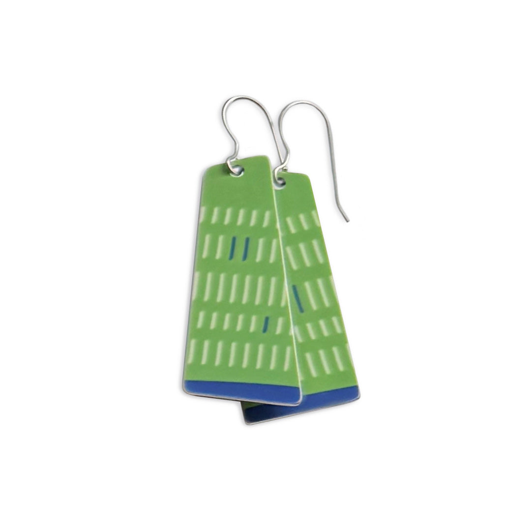 Green geometric earrings on a white background.