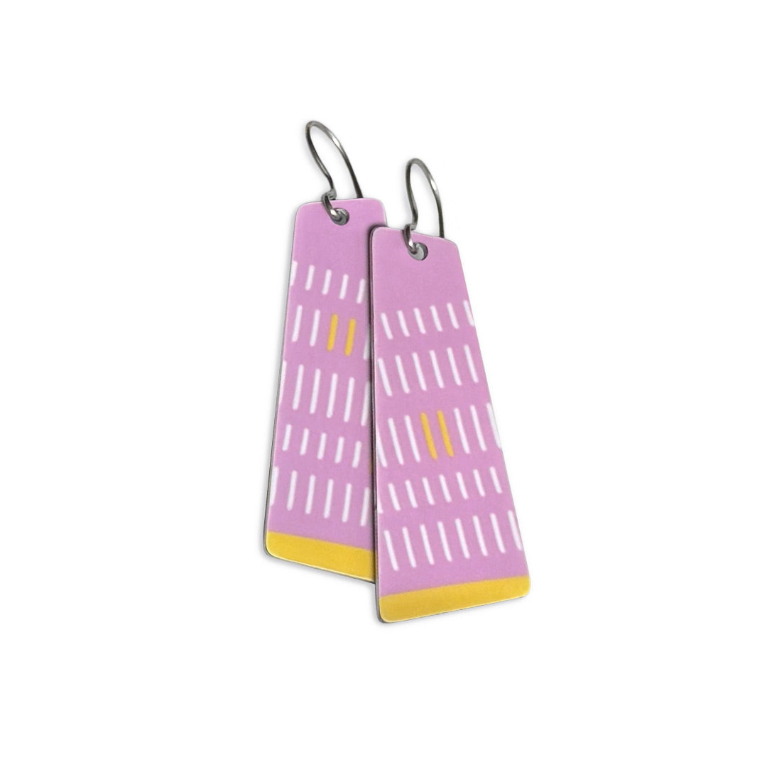 Sweet lavender rectangular earrings with a white line pattern and yellow accents on a white background.