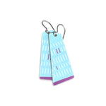 Pair of long, light blue earrings with purple accents on a white background.