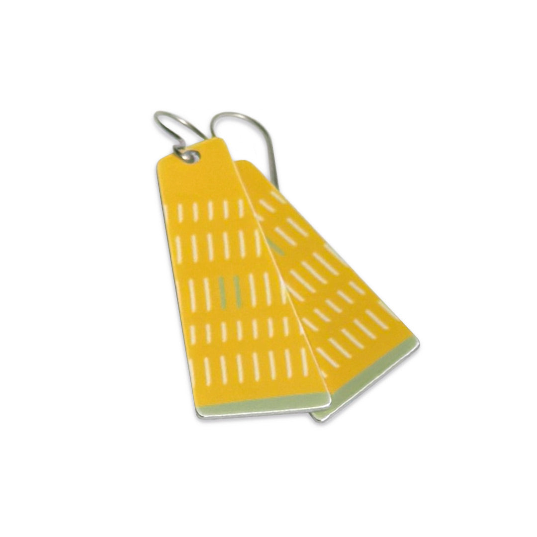 Bright yellow hypoallergenic earrings with a grid pattern on a white background.