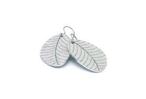 A pair of small leaf earrings in gray by ColorUpLife.