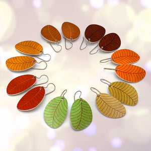 Seven small leaf earrings displayed in fall colors by ColorUpLife.