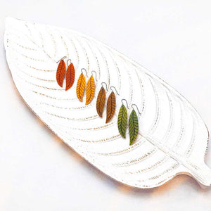Four long leaf earrings displayed in fall colors by ColorUpLife.