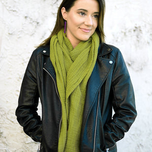 Woman weaing a dark chartreuse double gauze cotton scarf by ColorUpLife.